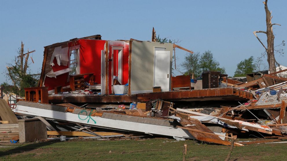 PHOTO: The remains of a home damaged by a tornado Sunday evening stands in Baxter Springs, Kan., April 28, 2014.
