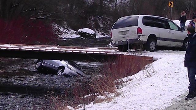 PHOTO: A photo provided by Chris Willden shows a car in the Logan River, Utah, after the car was flipped upright by rescuers who saved three children trapped in the car Dec. 31, 2011.
