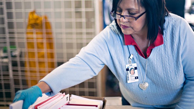 PHOTO: Postmaster Maria Carrasco sorts Valentine Day cards for mailing at the Valentine Post Office in Valentine, Texas in this Feb. 8, 2012 file photo.