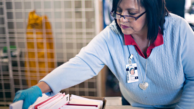 PHOTO: Postmaster Maria Carrasco sorts Valentine Day cards for mailing at the Valentine Post Office in Valentine, Texas in this Feb. 8, 2012 file photo.
