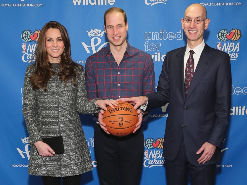 PHOTO: Prince William, the Duke of Cambridge, and Catherine, Duchess of Cambridge, pose for a photo with NBA Commissioner Adam Silver while attending a basketball game, Dec. 8, 2014 in New York.