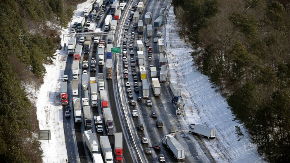 PHOTO: In this aerial photo, traffic is snarled along the I-285 perimeter north of the metro area after a winter snow storm on Jan. 29, 2014, in Atlanta.