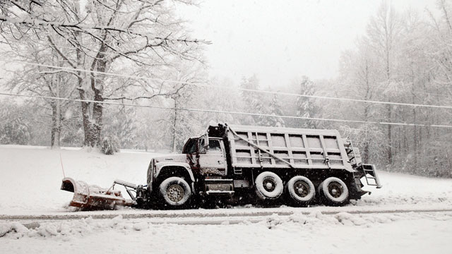 PHOTO: A snow plow rests in a ditch after sliding off of Brock Road in Spotsylvania, Va., March 6, 2013.
