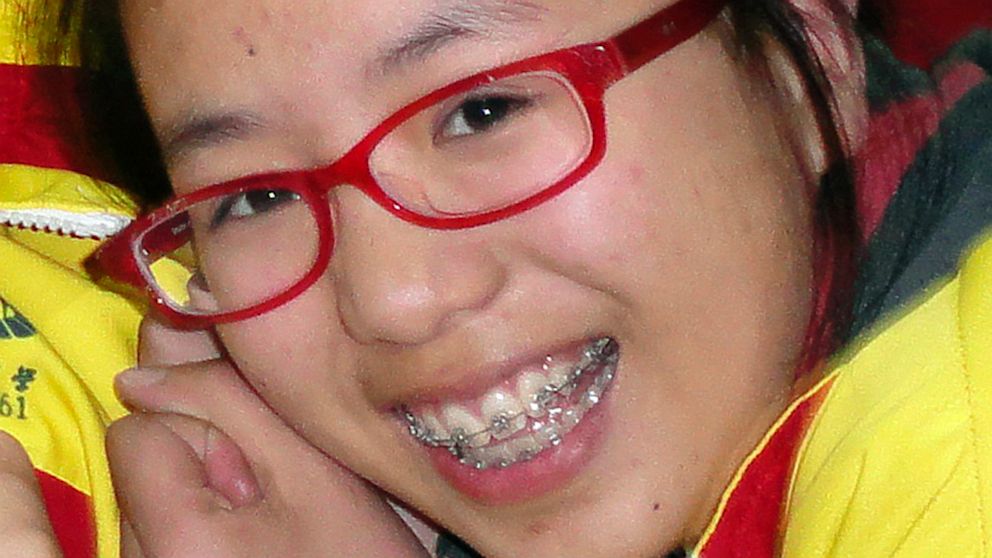 PHOTO: In this undated photo made available on July 15, 2013, Ye Mengyuan poses for photos with other classmates in the classroom in Jiangshan city in eastern Chinas Zhejiang province. Ye Mengyuan, 16, was a champion athlete who excelled at literature, p