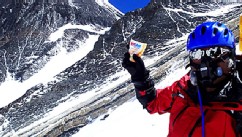 PHOTO: 80-year-old Japanese extreme skier Yuichiro Miura rests as he goes through the South Col pass to a camp at 8,000 meters (26,247 feet) during his attempt to scale the summit of Mount Everest.