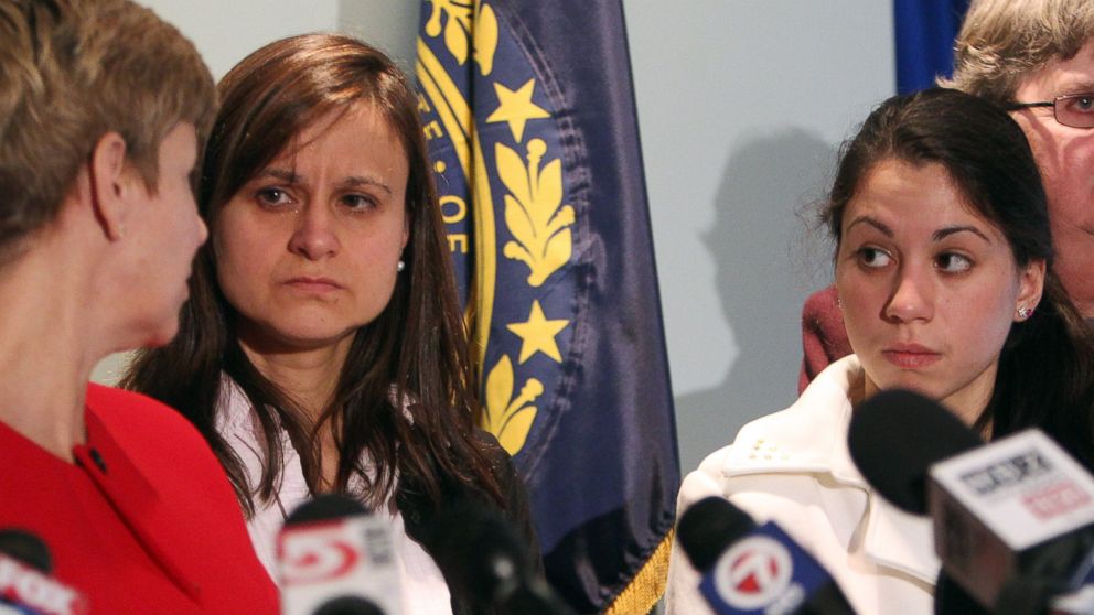 PHOTO: Zenya Hernandez, center, and her daughter, Sarah Hernandez look at Senior Assistant Attorney General Jane Young, during a news conference on Dec. 6, 2013 in Concord, N.H.