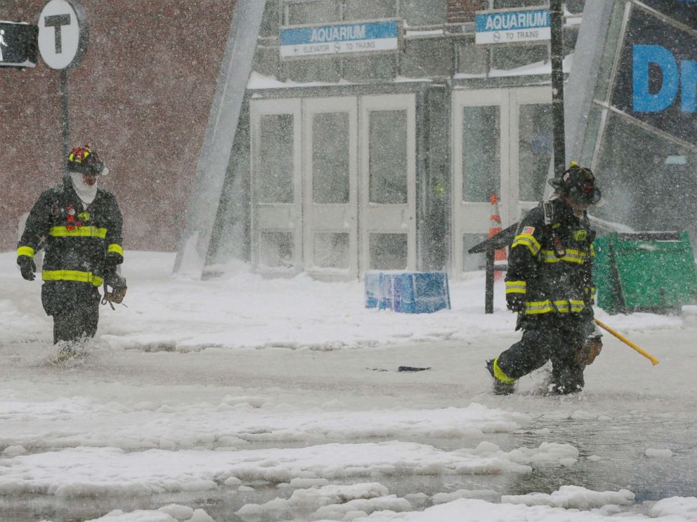PHOTO: Firefighters wade through a street flooded from tidal surge in Boston, Mass., Jan. 4, 2018. PHOTO: Firefighters wade through a street flooded from tidal surge in Boston, Mass., Jan. 4, 2018.