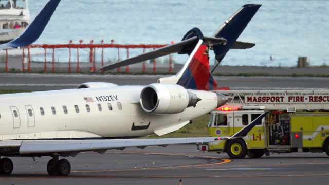 PHOTO: Two planes clipped each other while taxiing at Boston Logan International Airport, possibly injuring one person.