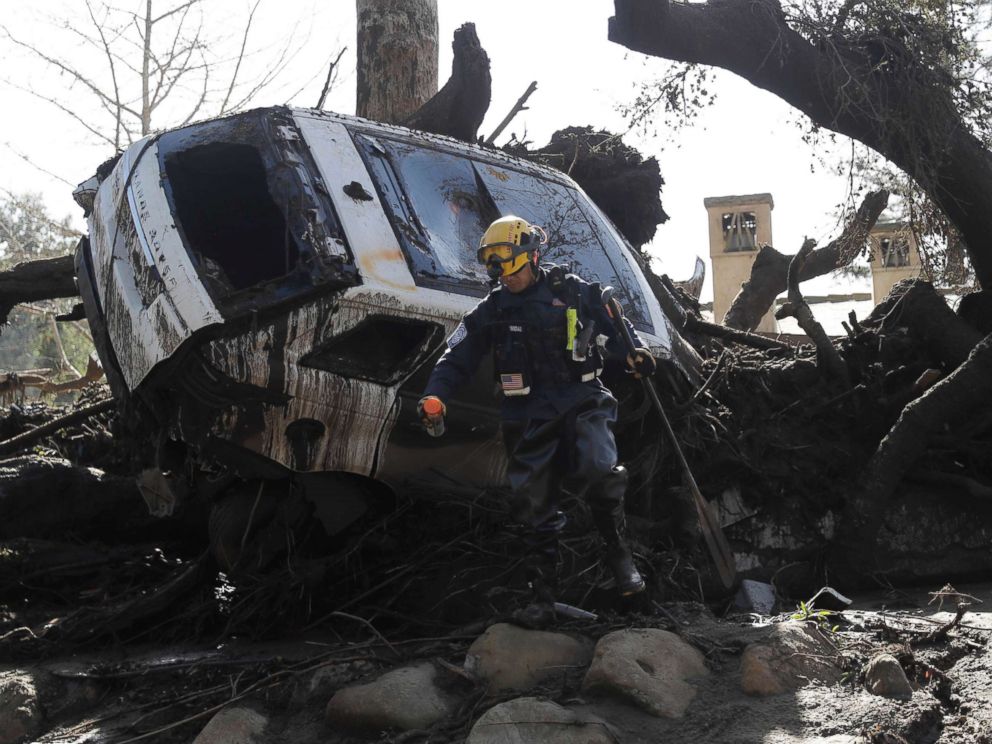 PHOTO: A member of the Los Angeles County Fire Department Search and Rescue crew works near a car trapped under debris in Montecito, Calif., Jan. 10, 2018.