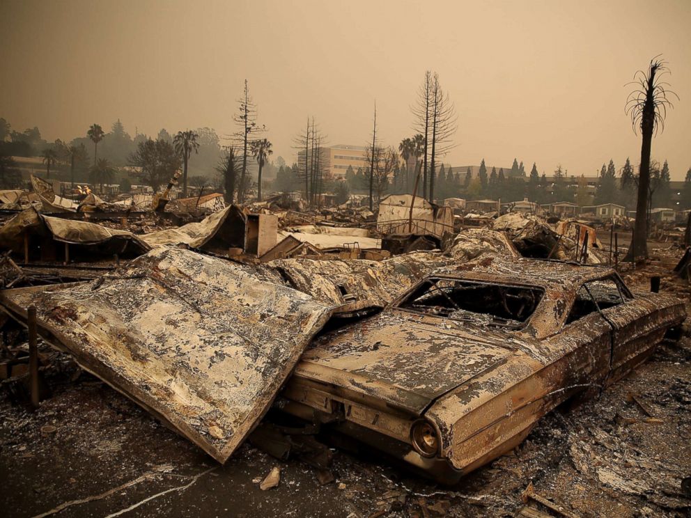 PHOTO: The remains of a fire damaged homes and cars at the Journeys End Mobile Home Park, Oct. 9, 2017 in Santa Rosa, Calif. 