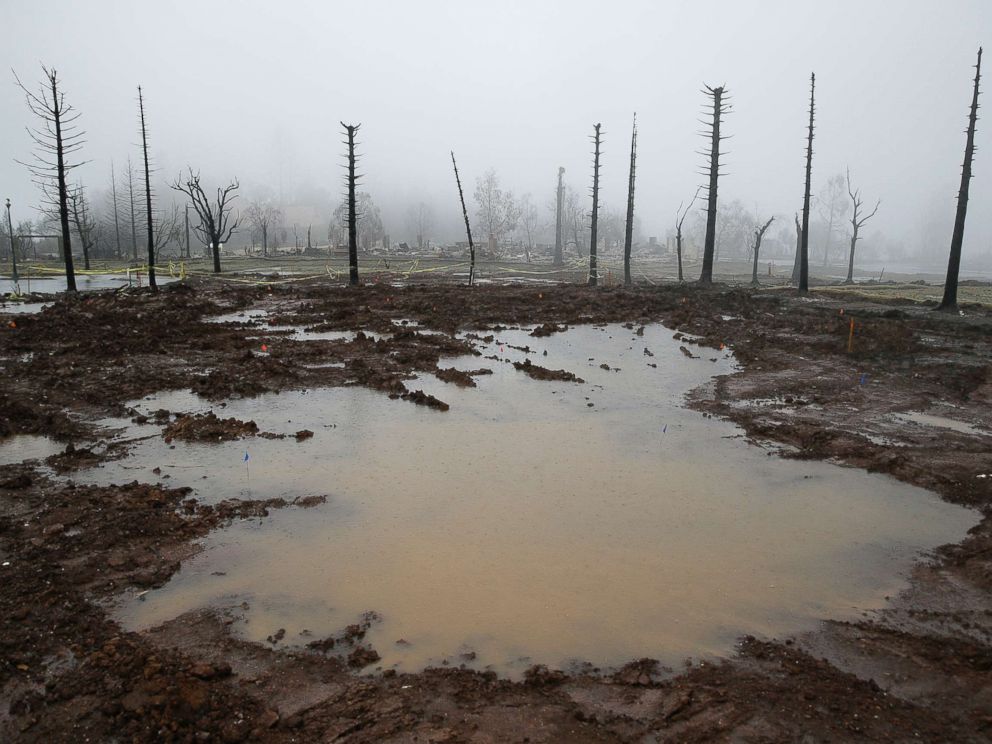 PHOTO: Rain water pools where a Fountaingrove neighborhood home once stood, Jan. 8, 2018, in Santa Rosa, Calif.