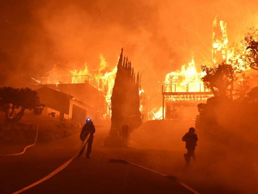 PHOTO: Firefighters work to put out a blaze burning homes early on Dec. 5, 2017, in Ventura, Calif. Authorities said the blaze broke out Monday and grew wildly in the hours that followed, consuming vegetation that hasnt burned in decades.