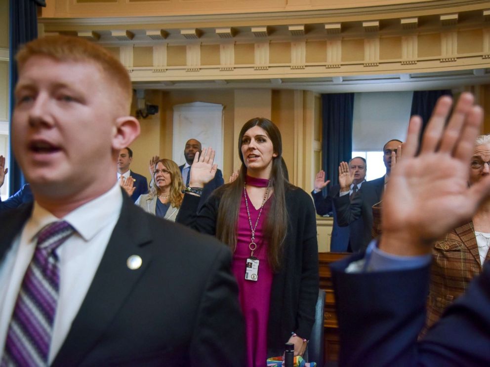 PHOTO: Delegate Danica Roem, center, and other delegates are sworn in on the floor of the House of Delegates at the Virginia State Capitol, Jan. 10, 2018, in Richmond, VA.