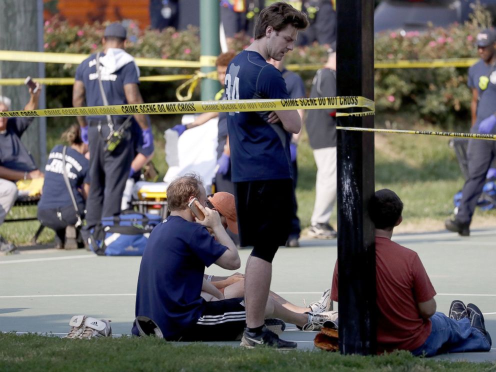 PHOTO: People gather near the scene of a shooting at the Republican Congressional baseball team practice in Alexandria, Va, June 14, 2017. 