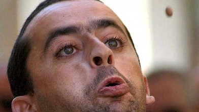 PHOTO: A man spits an olive core on Wednesday, Aug. 29, 2001 during the VII Olive Core Spitting Championship held in Cieza, in which more than a hundred people took part.