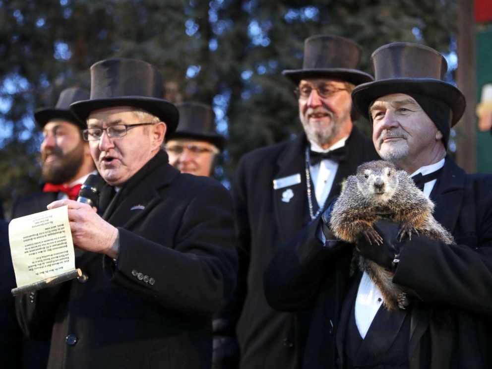 PHOTO: Groundhog Club co-handler John Grifiths (R) holds Punsxutawney Phil the weather prognosticating groundhog as groundhog club vice president Jeff Lundy (L) reads his prediction during the Groundhog Day in Punxsutawney, Penn., Feb 2, 2018.