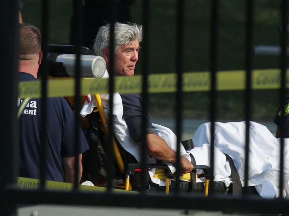 PHOTO: Rep. Roger Williams is wheeled away by emergency medical service personnel from the Eugene Simpson Stadium Park June 14, 2017 in Alexandria, Va., following a shooting at the park.