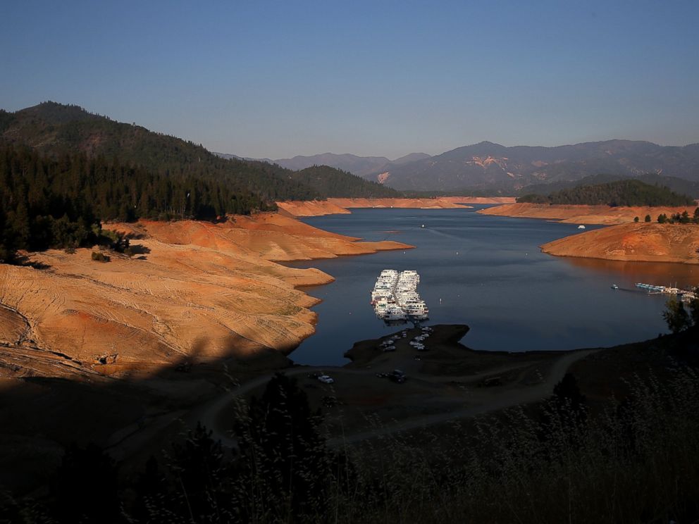 PHOTO: Houseboats are dwarfed by the steep banks of Shasta Lake at Bridge Bay Resort on Aug. 31, 2014 in Redding, Calif. when the lake reached about 30 percent of its total capacity, the lowest it had been since 1977.