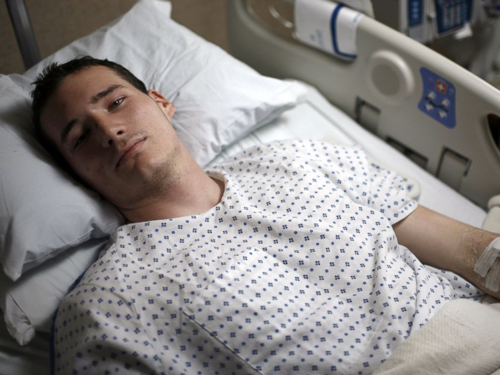 PHOTO: Virginia Tech student Colin Goddard lies in his hospital bed on April 19, 2007 in Blacksburg, Va.