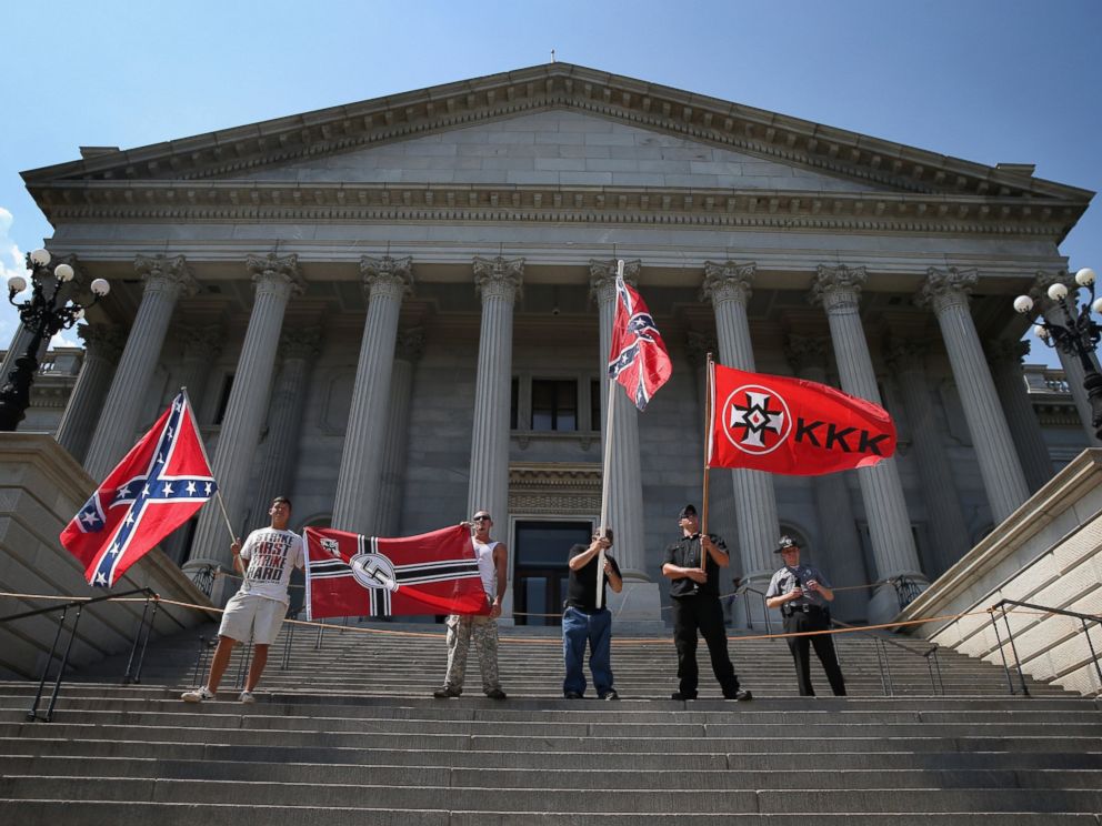 PHOTO: Ku Klux Klan members take part in a Klan demonstration at the state house building on July 18, 2015 in Columbia, South Carolina.