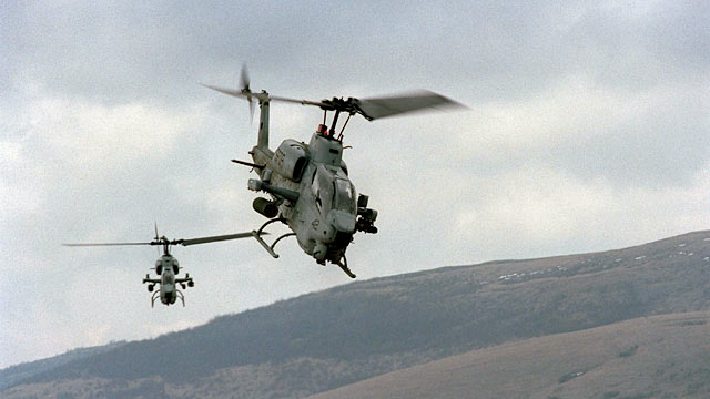 PHOTO: Two U.S. Marine AH-1W Super Cobra helicopters from the 26th Marine Expeditionary Unit training.