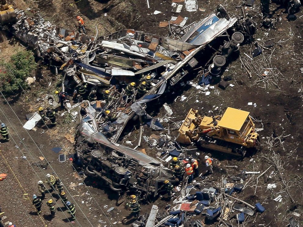 PHOTO: Investigators work near the wreckage of a derailed Amtrak passenger train in this May 13, 2015 file photo in north Philadelphia.