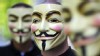 PHOTO: Activists of the organization "Anonymous" hold masks in front of their faces during a demonstration in Berlin.