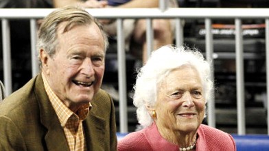 Former President George H.W. Bush and wife, Barbara, attend the NCAA Final Four semifinal basketball game in Houston, Texas, April 2, 2011.