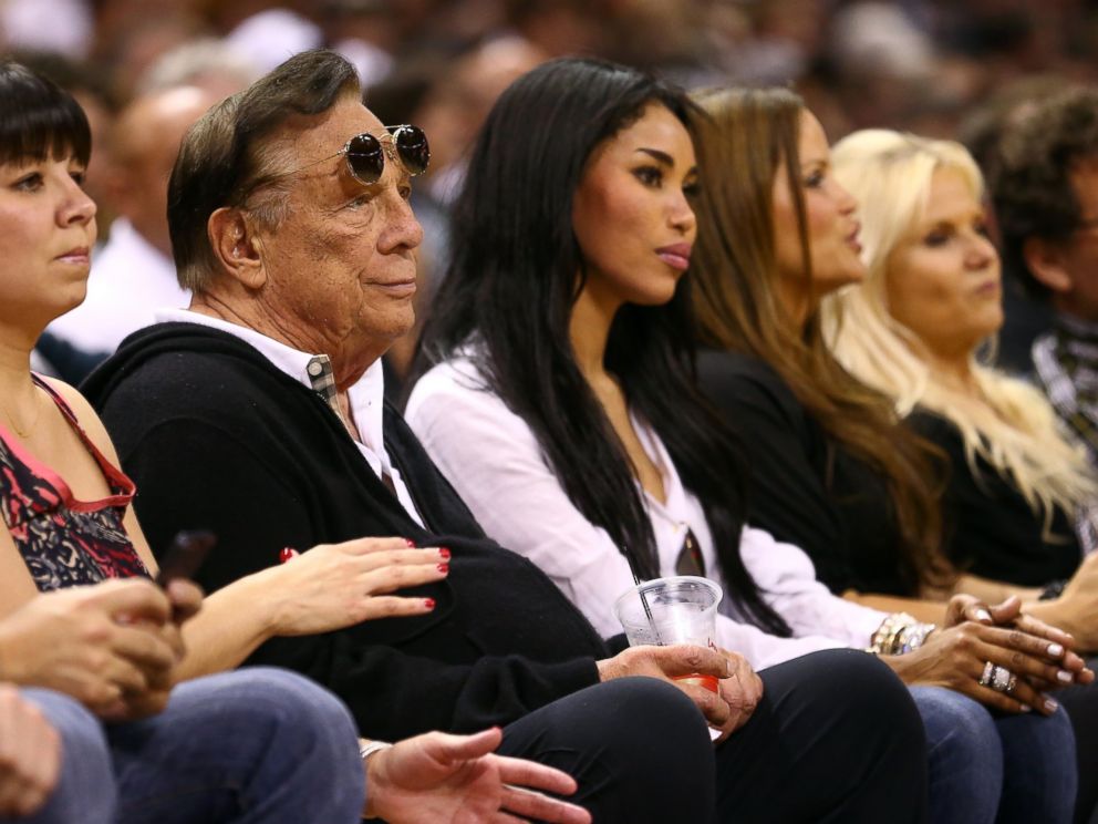 PHOTO: Team owner Donald Sterling of the Los Angeles Clippers and V. Stiviano watch the San Antonio Spurs play  on May 19, 2013 in San Antonio, Texas.  