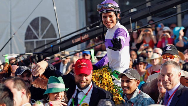 PHOTO: Jockey Mario Gutierrez celebrates in the winners circle after riding I'll Have Another to win the 137th Preakness Stakes at Pimlico Race Course.