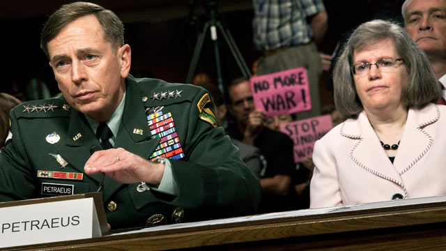 PHOTO: Gen. David Petraeus, left, and his wife Holly Petraeus are shown on Capitol Hill, June 29, 2010 in Washington, DC.