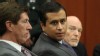 PHOTO: George Zimmerman, center, sits during his bond hearing with his attorney Mark O'Mara, left, in a Seminole County courtroom on June 29, 2012 in Sanford, Fl.