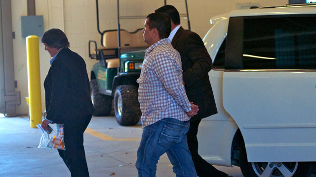 PHOTO: George Zimmerman (C) is escorted by police as he returns to Seminole County Jail after having his bond revoked because of allegedly misleading the court about his finances June 3, 2012 in Sanford, Florida.