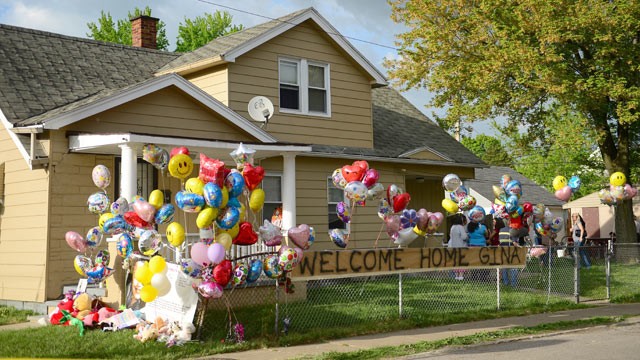 PHOTO: The family house of Gina DeJesus, one of the three women which were held captive for a decade, is decorated by well wishers May 7, 2013 in Cleveland, Ohio.