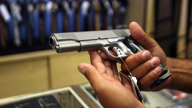PHOTO: A man chooses a gun at a gun shop in Glendale, California.