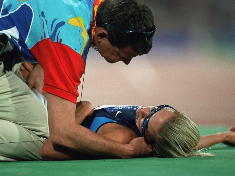 PHOTO: Suzy Favor-Hamilton lays on the track from over exertion after the womens 1500 meter race during the Olympics at the Olympic Stadium in Sydney, on Sept. 30, 2000.
