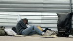 PHOTO: A homeless man rests beside a street in Las Vegas, November 13, 2011. Permanent supportive housing has made big strides in reducing homelessness this decade.