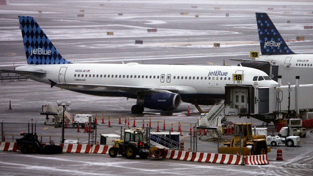 PHOTO: Jet Blue planes sit on the tarmac outside the Jet Blue terminal at John F. Kennedy Airport in New York City, in this file photo.