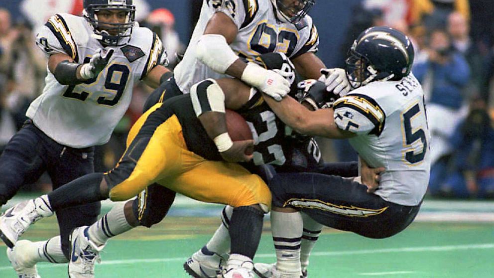 PHOTO: Junior Seau stops John Williams during AFC Championship game