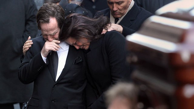 PHOTO: Matthew and Madonna Badger embrace as the casket of one of their three daughters arrives for funeral services in this Jan. 5, 2012 in New York City.
