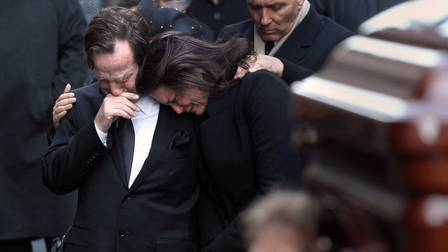 PHOTO: Matthew and Madonna Badger embrace as the casket of one of their three daughters arrives for funeral services in this Jan. 5, 2012 in New York City.