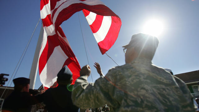 PHOTO: A replica of the famous flag Francis Scott Key witnessed "by the dawn's early light" is raised by newly naturalized citizens during a US Naturalization Ceremony for 17 active duty military candidates Sept. 24, 2007 at the Fort McHenry National Monu