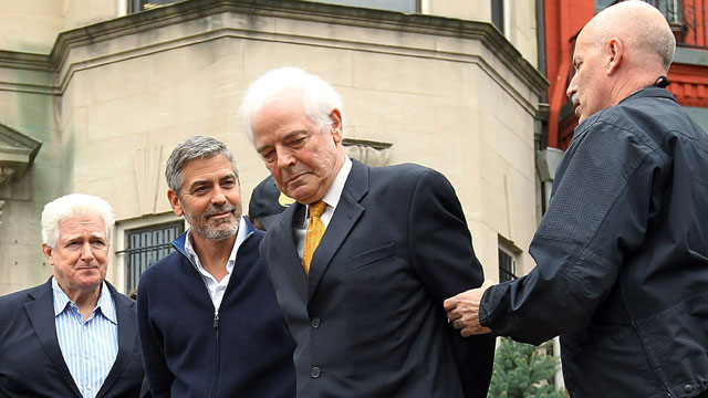 PHOTO: Journalist Nick Clooney and his son actor George Clooney are arrested by members of the U.S. Secret Service Uniform Division during a protest outside the Sudanese Embassy March 16, 2012 in Washington, DC.