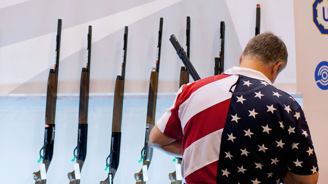 PHOTO: Chris Patrie looks at the Benelli display of shotguns in this file photo from the NRA Annual Meetings and Exhibits on April 13, 2012 at the Americas Center in St. Louis, Missouri.