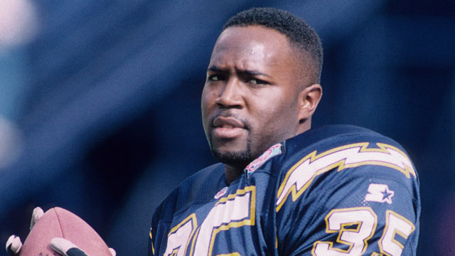 PHOTO: Running back Rodney Culver #35 of the San Diego Chargers tosses a pass prior to playing against the Miami Dolphins in the 1994 AFC Divisional Playoff Game at Jack Murphy Stadium on January 8, 1994 in San Diego, California.
