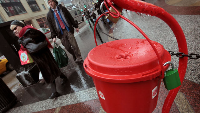 PHOTO: Shoppers walk past a Salvation Army kettle, Dec. 21, 2010 in Chicago, Illinois.