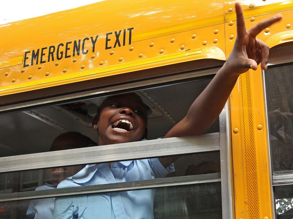 PHOTO: A third grade student arrives by bus on the first day of school at Ellis Elementary in Boston, Mass. on Sept. 5, 2012.