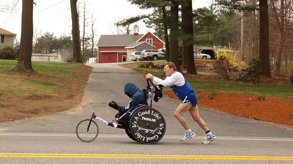 PHOTO: Dick Hoyt pushes Rick Hoyt as they compete in the 2008 Boston Marathon on April 21,2008 in Hopkinton, Massachusetts.