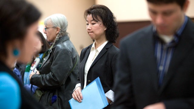 PHOTO: Graduate student Ali Adcock, center, waits in line to present herself to a potential employer at a job fair, Dec. 2, 2011 in Portland, Ore.