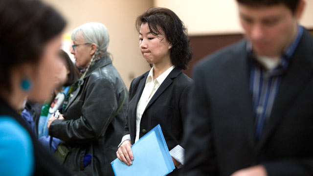 PHOTO: Graduate student Ali Adcock, center, waits in line to present herself to a potential employer at a job fair, Dec. 2, 2011 in Portland, Ore.